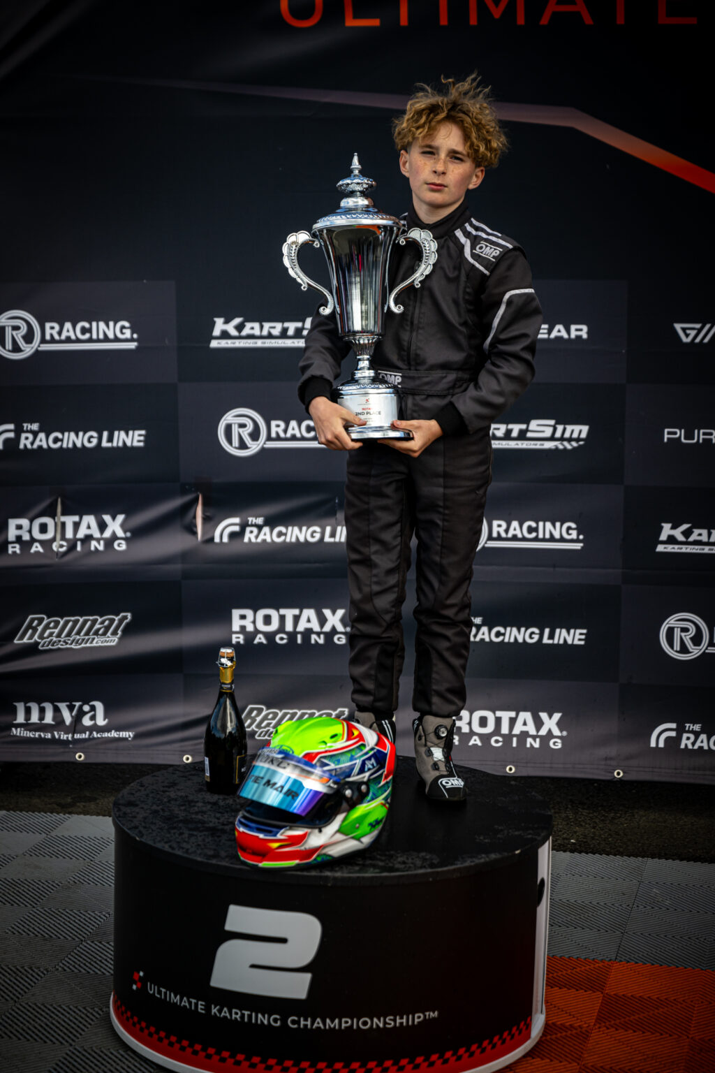 Alfie Mair proudly holding his second-place trophy at UKC Round 2 in Larkhall after a remarkable drive through the field
