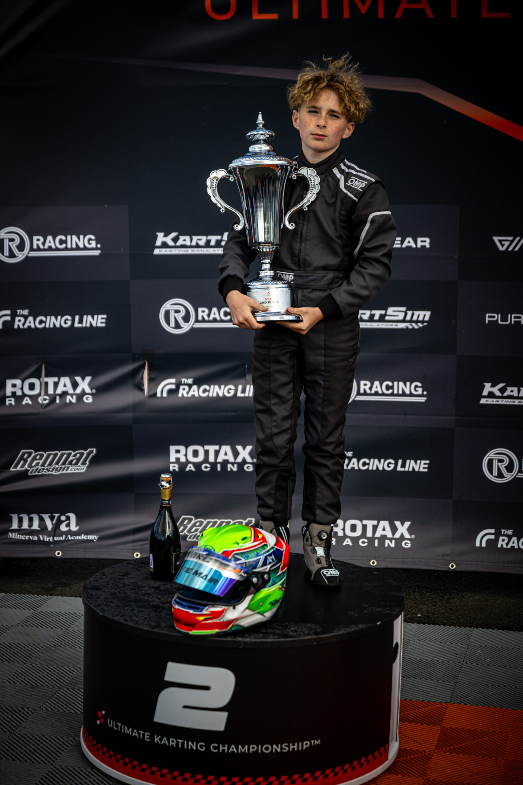 Alfie Mair proudly holding his second-place trophy at UKC Round 2 in Larkhall after a remarkable drive through the field